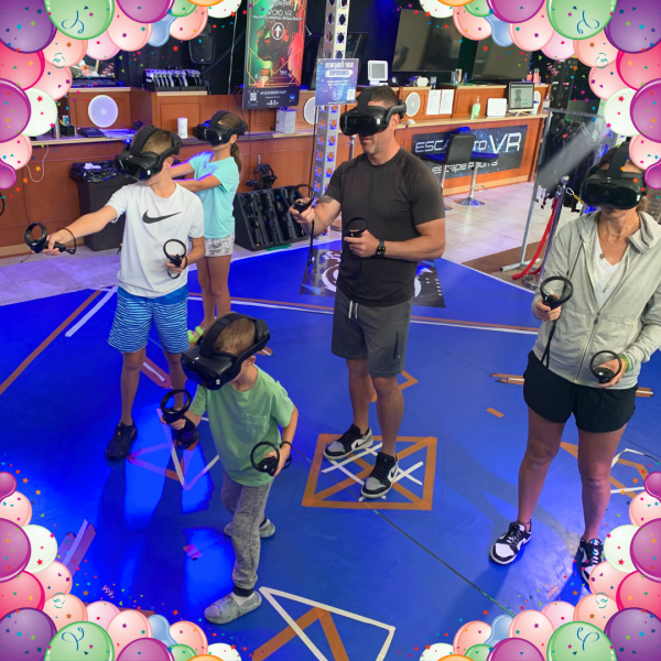 Photo of 5 people playing VR in an arena